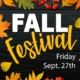 Colorful fall leaves and red berries surround bold text on a dark wood background. The text reads: "FALL Festival" in large white and yellow letters, with "Friday Sept. 27th" below in smaller white font. The leaves display shades of red, orange, yellow, and green, creating a festive autumn atmosphere.